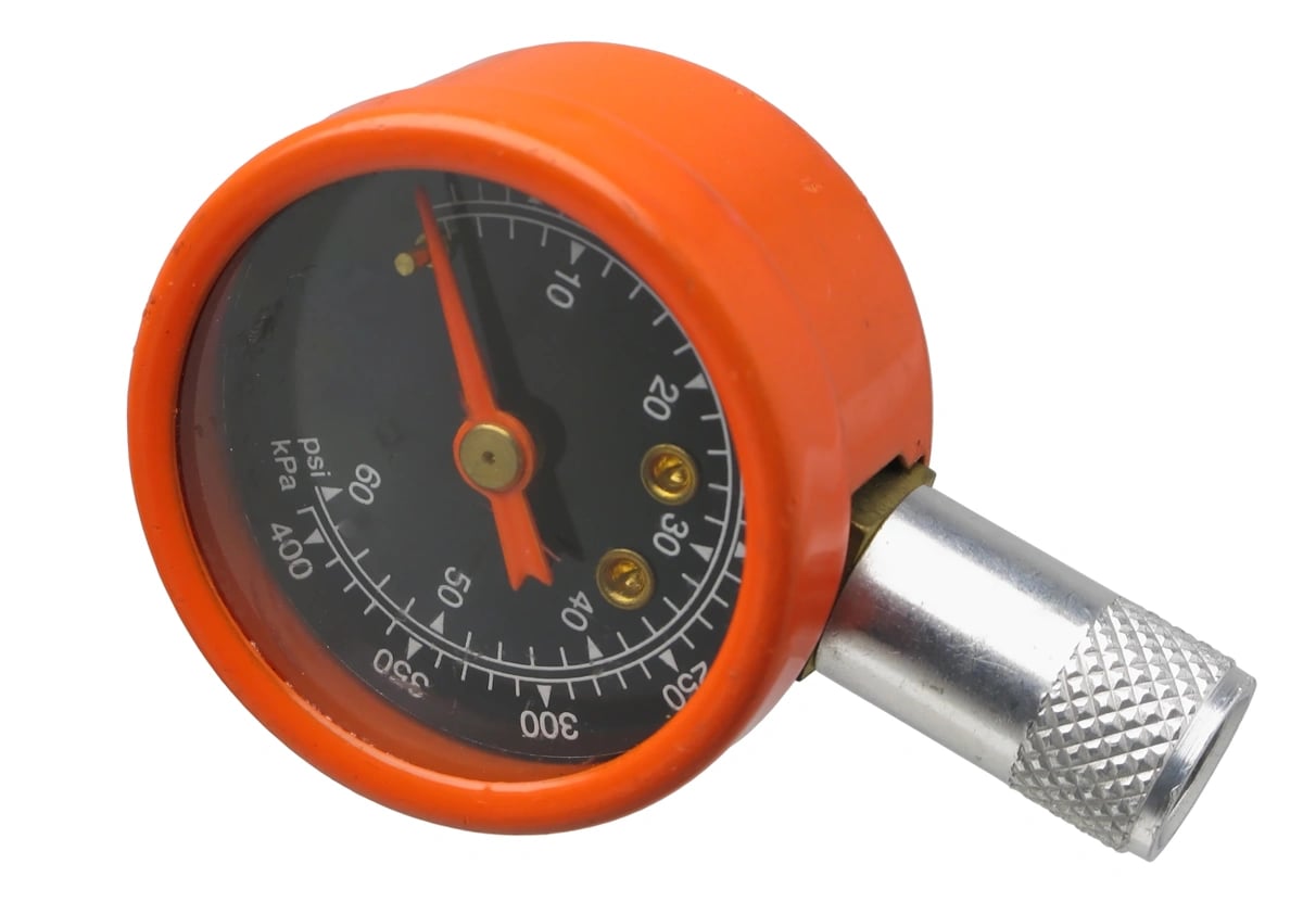 round style tire gauge in orange.webp