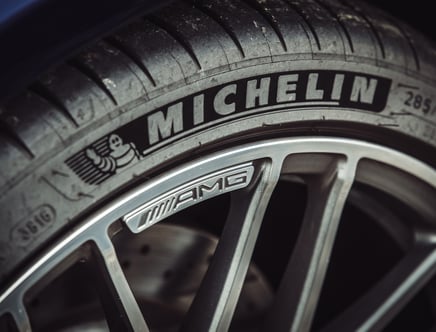 Close-up of a Michelin tire on a car with an AMG alloy wheel.