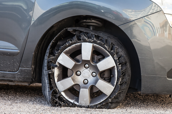 A blown out tire and bent rim